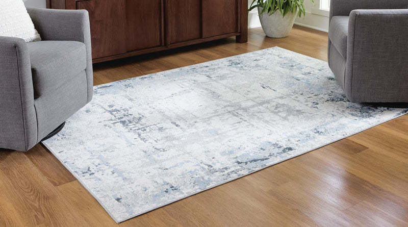 Signature Design by Ashley washable rug with colorful geometric pattern, soft textile, and durable construction.
