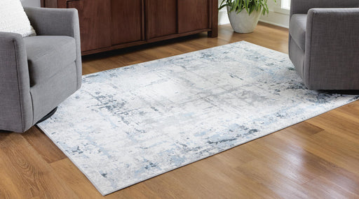 Signature Design by Ashley washable rug with colorful geometric pattern, soft textile, and durable construction.