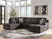 Signature Design by Ashley Lentiz stationary sectional sofa with plush cushions and modern design in a living room setting.