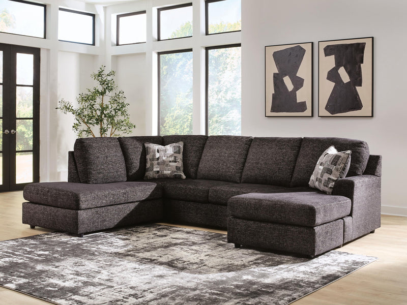 Signature Design by Ashley Lentiz stationary sectional sofa with plush cushions and modern design in a living room setting.