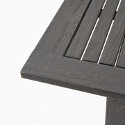 Outdoor expandable dining table with square legs by Noble House, showing the wooden surface and adjustable size for outdoor dining.