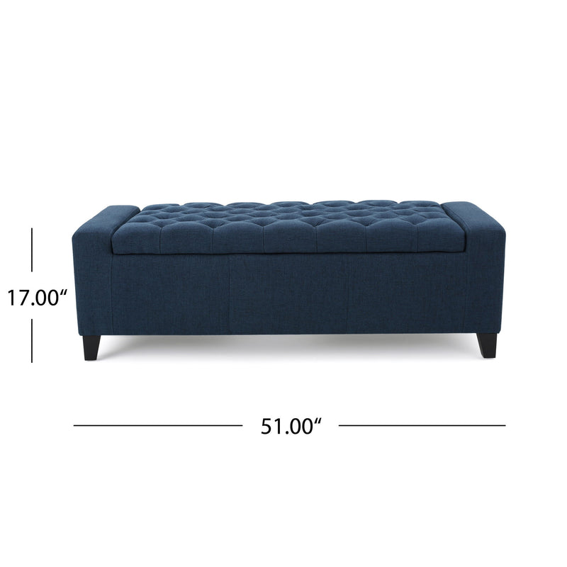 Noble House Guernsey storage ottoman with tufted top, wooden legs, and soft fabric upholstery for stylish, functional living room storage.