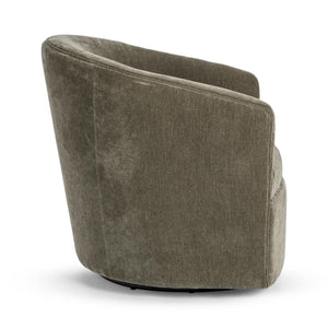 Classic Home Valencia swivel accent chair with patterned fabric and wooden base, positioned in a cozy living room setting.
