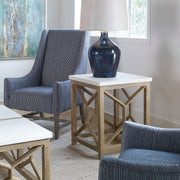 Uttermost Catali stone end table with white and light brown finish, showcasing a modern design with a smooth stone top and stylish base.