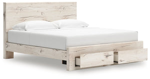 Signature Design by Ashley Lawroy panel storage bed with built-in drawers and modern wood finish visible in the image.