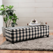 Black Noble House contemporary storage ottoman with padded seating and hidden storage compartment.