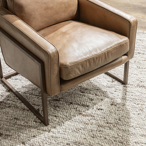 Classic Home Ken club chair in a neutral upholstery with a cushioned seat and backrest