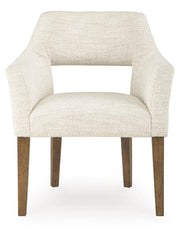 Pair of Benchcraft Marxmore beige and brown upholstered dining arm chairs with padded seats and wooden legs.