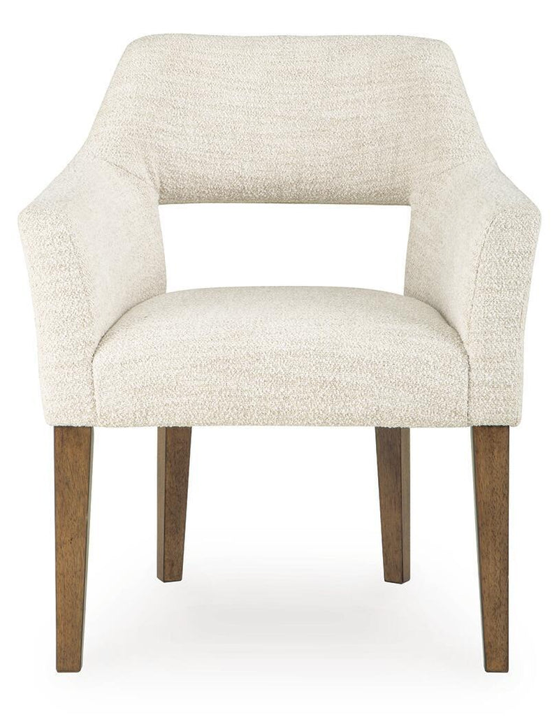 Pair of Benchcraft Marxmore beige and brown upholstered dining arm chairs with padded seats and wooden legs.