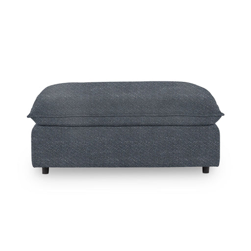 Classic Home Caplan upholstered ottoman with a cushioned top and wooden legs, ideal for living room or bedroom decor.