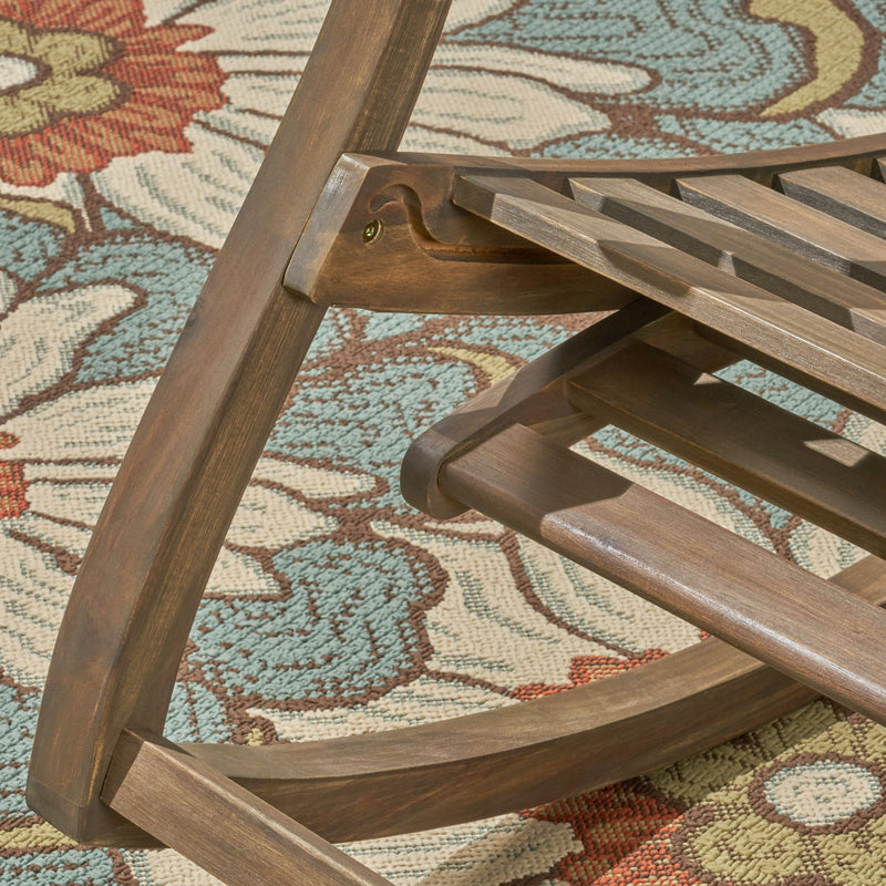 Gray outdoor reclining rocking chair by Noble House, featuring a comfortable design and sturdy frame for outdoor relaxation.