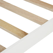 DreamHaus platform bed with slat support, headboard, and footboard in a modern wooden design on a bedroom floor.