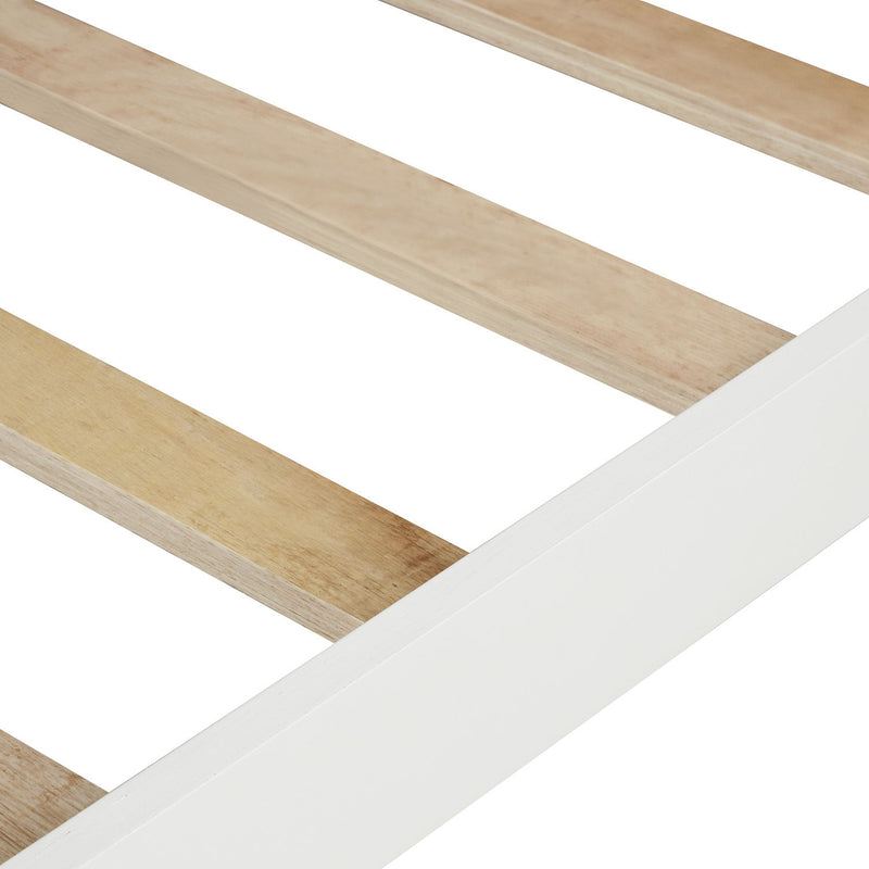 DreamHaus platform bed with slat support, headboard, and footboard in a modern wooden design on a bedroom floor.