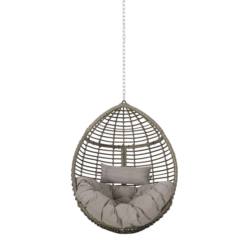 Noble House Morris Teardrop hanging chair with chain and water-resistant cushions, shown in a cozy outdoor setting.