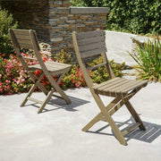 Set of two Noble House outdoor foldable wood dining chairs with slat design, ideal for patio or garden seating.