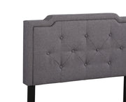 Button tufted upholstered bed by Glory Furniture, featuring plush fabric and elegant design for cozy bedroom spaces.