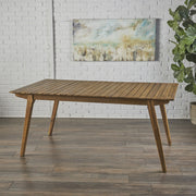 Outdoor teak dining table and frame by Noble House, showcasing a spacious wooden table with sturdy legs for outdoor dining.