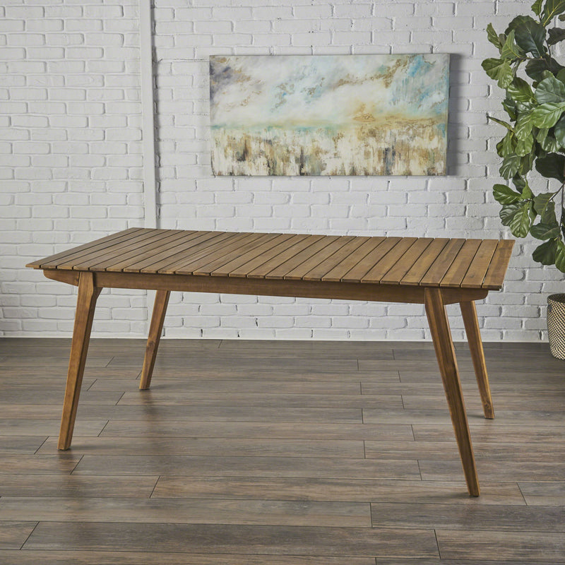Outdoor teak dining table and frame by Noble House, showcasing a spacious wooden table with sturdy legs for outdoor dining.