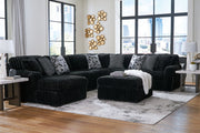 Signature Design by Ashley Midnight Madness 4-piece sectional set with plush cushions and modern design for stylish living rooms.