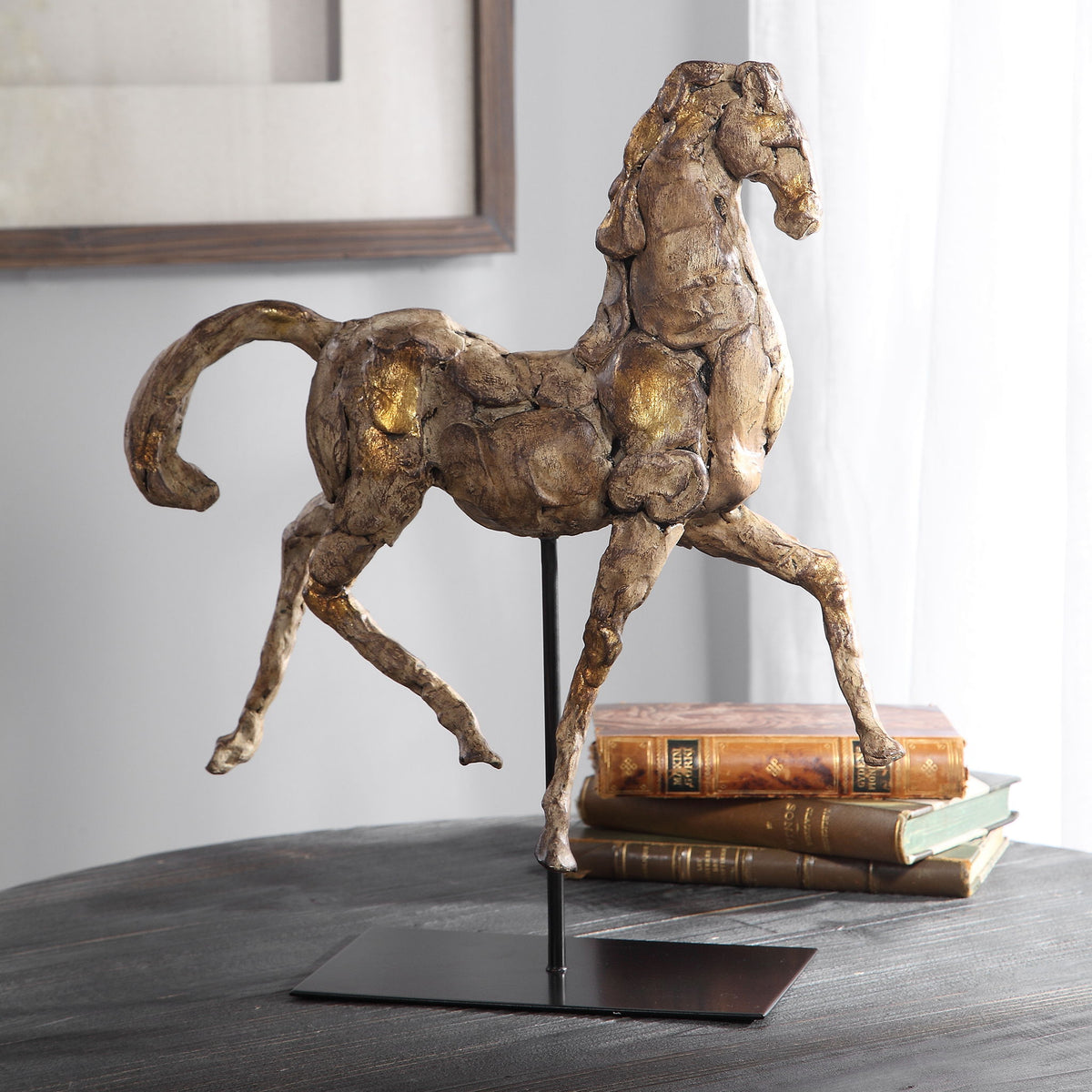 Gold horse sculpture by Uttermost, detailed Caballo figurine with a shiny, metallic finish, perfect for decorative display.