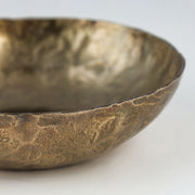 Set of three TOV Furniture Shah hammered iron catchall round bowls in antique brass, perfect for serving or decorative use.