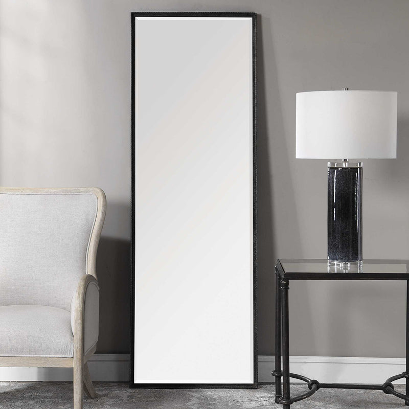 Uttermost Callan Leaner Mirror in black with sleek modern frame, standing tall against a neutral background.