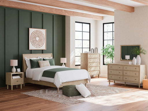 Signature Design by Ashley Cielden 8-piece panel bedroom set with bed frame, dresser, mirror, and nightstands in a modern bedroom setup.