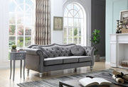 Glory Furniture Hollywood stationary sofa with plush beige upholstery and modern design, shown in a stylish living room setting.
