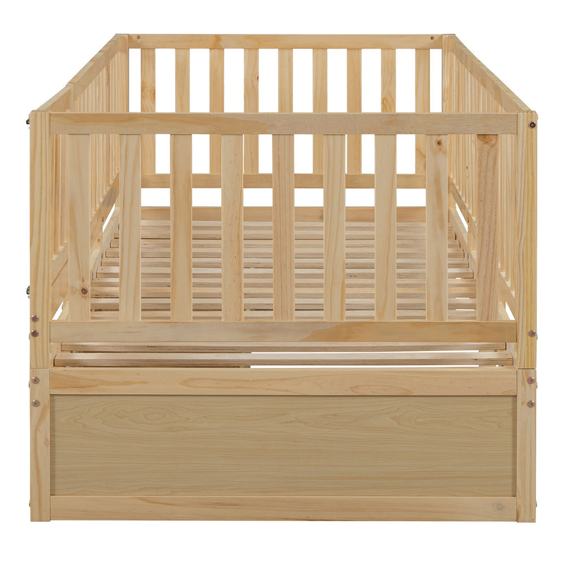 DreamHaus storage daybed with fence guardrails and two drawers, convertible into a floor bed and daybed for versatile sleeping options.