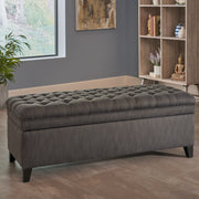 Noble House Juliana storage ottoman with birch legs, upholstered in neutral fabric, serving as a stylish and functional living room accent.