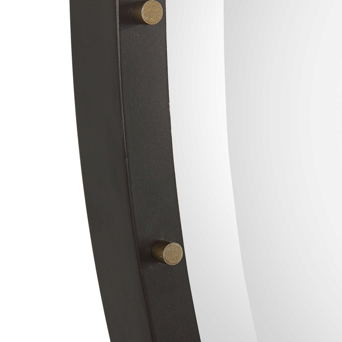 Benedo round black wall mirror by Uttermost with a sleek, modern frame, hanging on a plain wall.