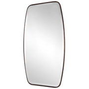 Uttermost Canillo wall mirror with a sleek frame, hanging on a modern wall, showcasing elegant mirror design and craftsmanship.