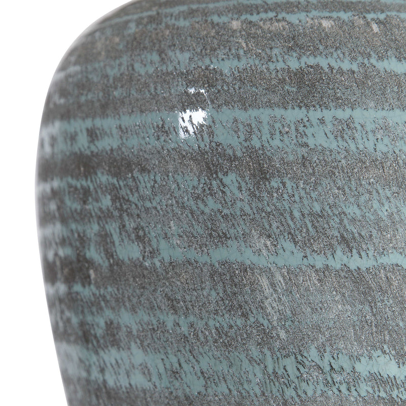 Uttermost Pelia table lamp in light aqua with a sleek ceramic base and fabric shade, ideal for modern home decor.