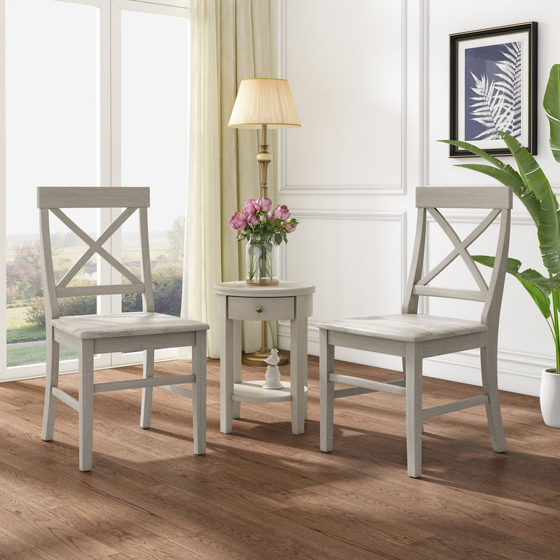 Pair of Noble House Plethora dining chairs with X-shaped backs, set of two, featuring wooden legs and cushioned seats.