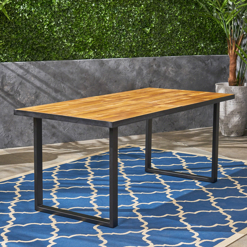 Noble House outdoor teak dining table with U-shaped legs and slat top, perfect for patio or garden outdoor dining.