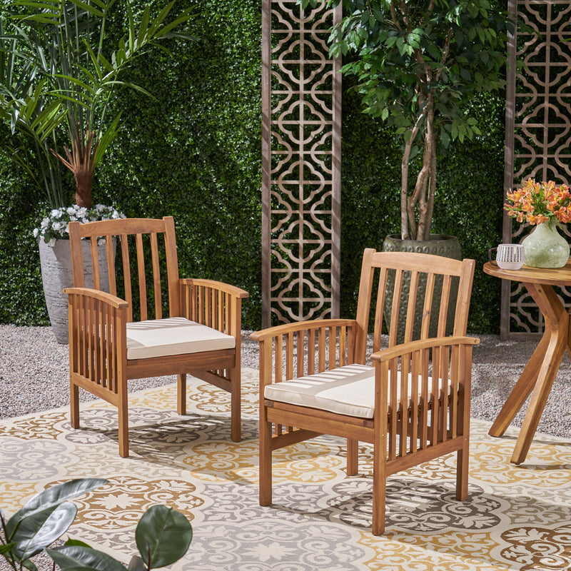 Noble House Casa acacia dining chair set with cushioned seats, showcasing two stylish wooden chairs with beige cushions.