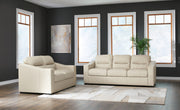 Signature Design by Ashley almond stationary sofa and loveseat set, featuring plush cushions and fabric upholstery.
