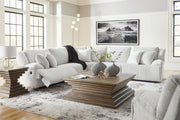 Six-piece Signature Design by Ashley reclining living room set with sofa, loveseat, and armchairs in neutral fabric.