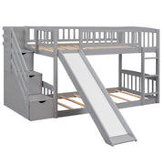 Gray DreamHaus twin over twin bunk bed with stairs, two drawers, and slide, featuring a sturdy and space-saving design.