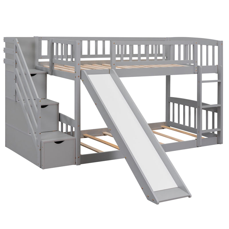 Gray DreamHaus twin over twin bunk bed with stairs, two drawers, and slide, featuring a sturdy and space-saving design.