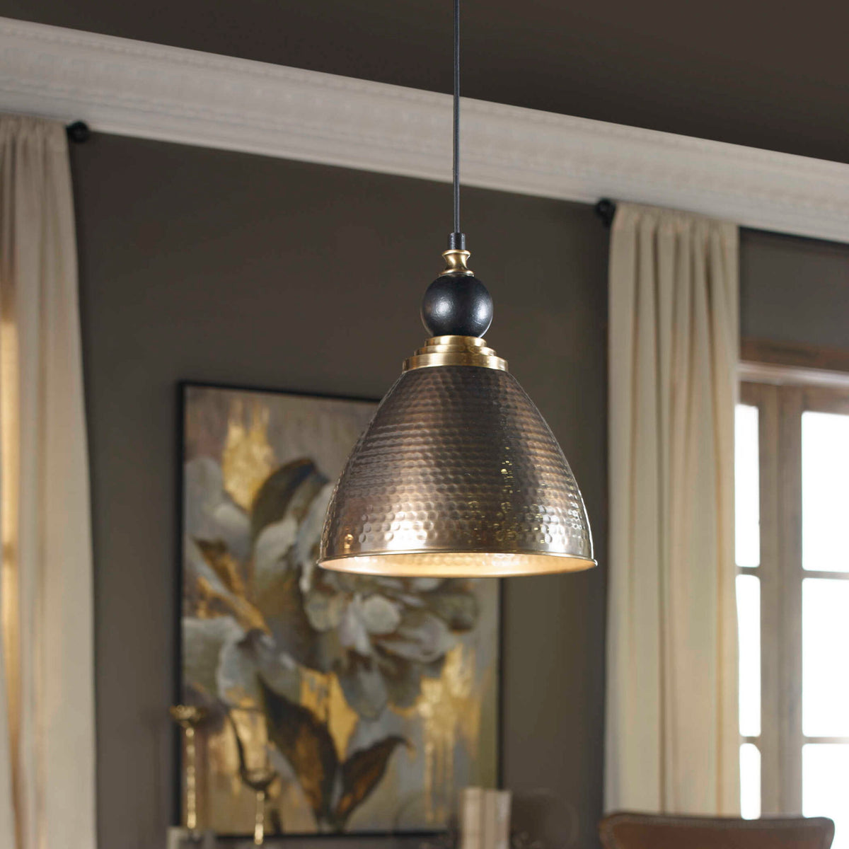 Uttermost Adastra 1-light pendant in antique brass with a sleek, modern design for stylish ceiling lighting.
