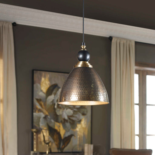 Uttermost Adastra 1-light pendant in antique brass with a sleek, modern design for stylish ceiling lighting.