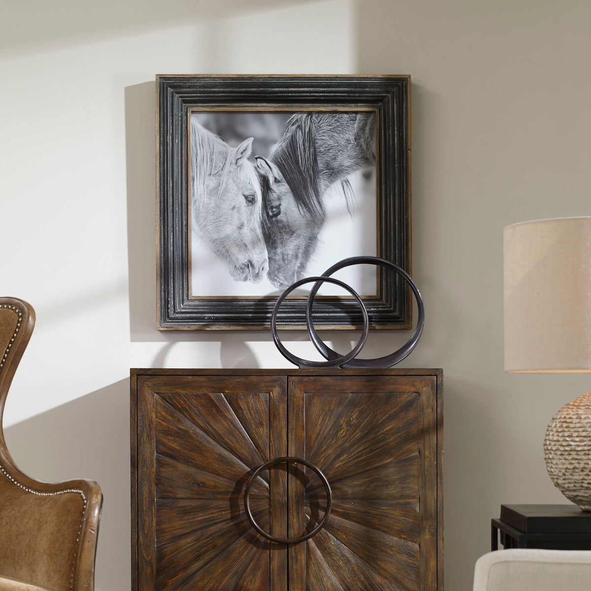 Framed black and white horse print with dark brown frame by Uttermost, showcasing detailed equine artwork on paper.