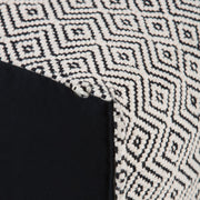 Simpli-Home Brynn square accent pouf with black and natural patterned fabric, versatile seating or footrest option.