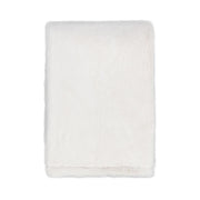 Classic Home Taiga throw blanket with soft, textured fabric in earthy tones, perfect for cozying up on the sofa.