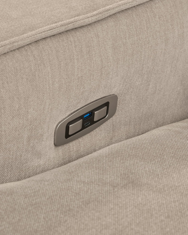 Benchcraft Carceri reclining sectional sofa with plush cushions and reclining seats in a modern living room setting.