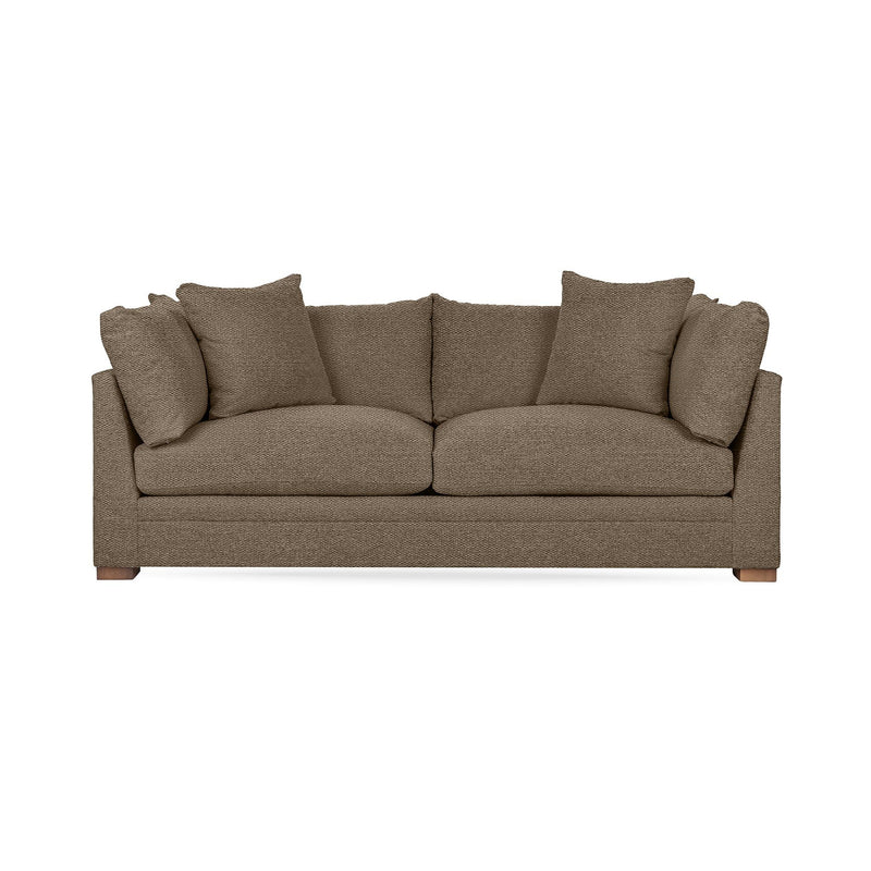 Classic Home Audrey stationary sofa with plush fabric, featuring a sleek design and comfortable cushioning in a cozy living room setting.