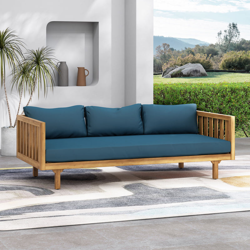 Noble House Claremont 3 Seater Daybed sofa with teak acacia wood frame and water-resistant cushions, ideal for outdoor lounging.