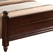 Hand-carved traditional panel bed by Glory Furniture featuring intricate woodwork and classic design in a warm finish.