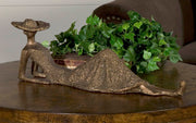 Antique bronze sculpture titled Summer Days by Uttermost, featuring a detailed figurine with a warm, textured finish.